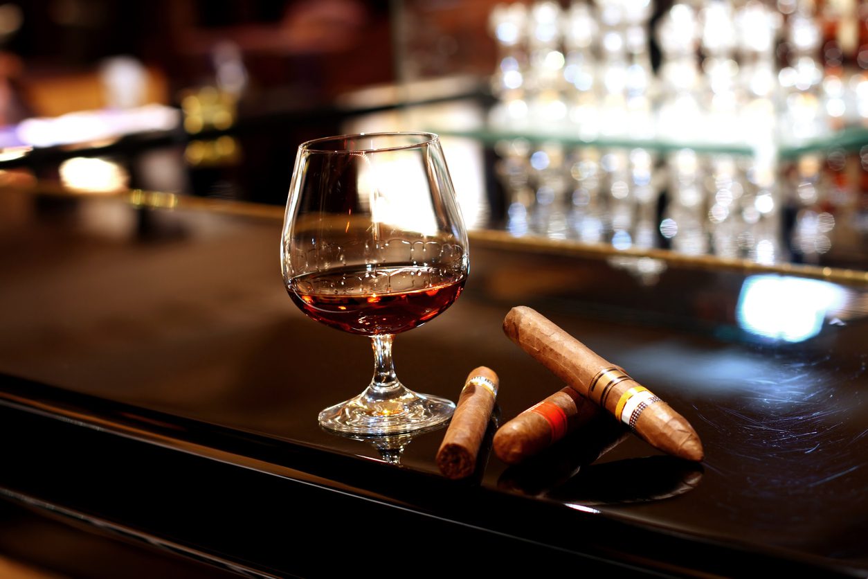 a glass of cognac and cigars in loungesimilar images: