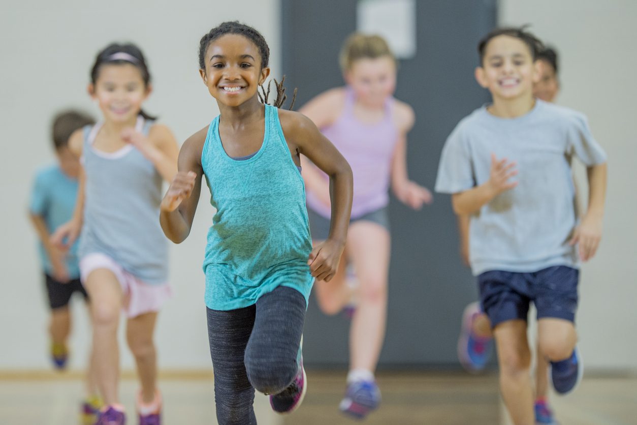 Group of kids running towards the camera