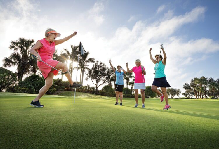 Group of women golf friends celebrate a hole-in-one